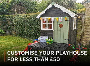 Painted green wooden playhouse with Easter decorations and wording 'Customise your playhouse for less than £50'.