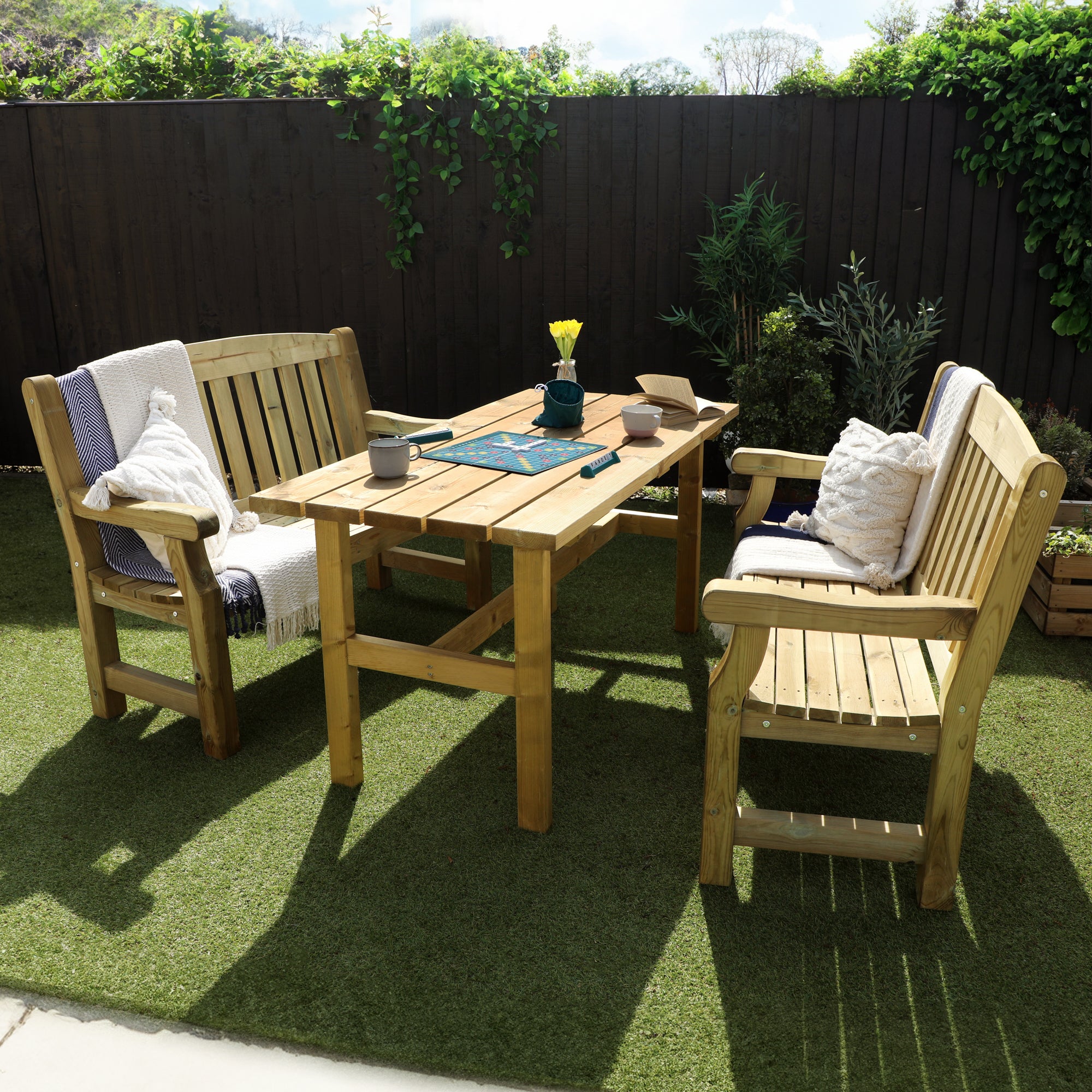 A picture of a timber bench and table set, featuring two benches and a wooden table
