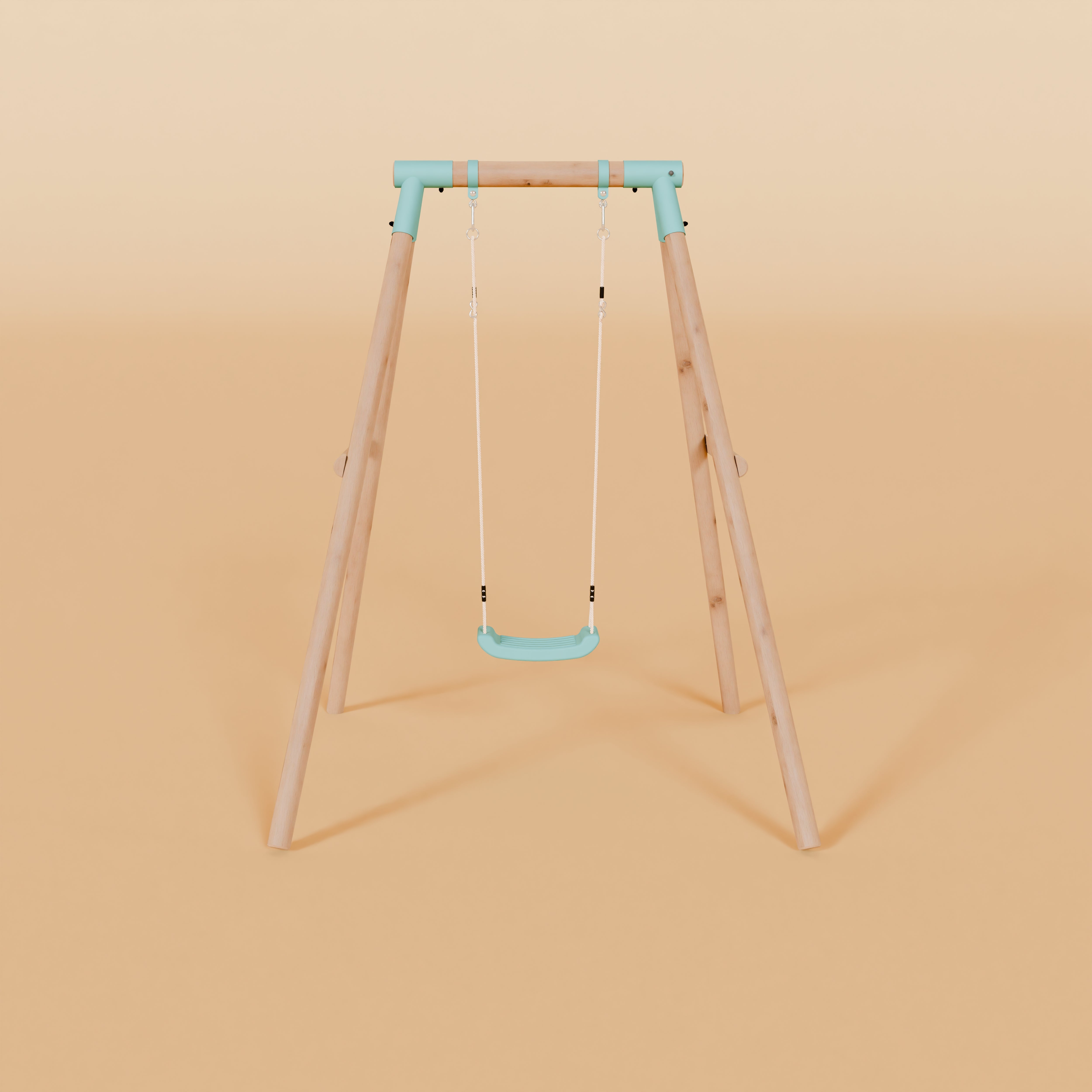 Children's swing with blue seat and stands on a beige background