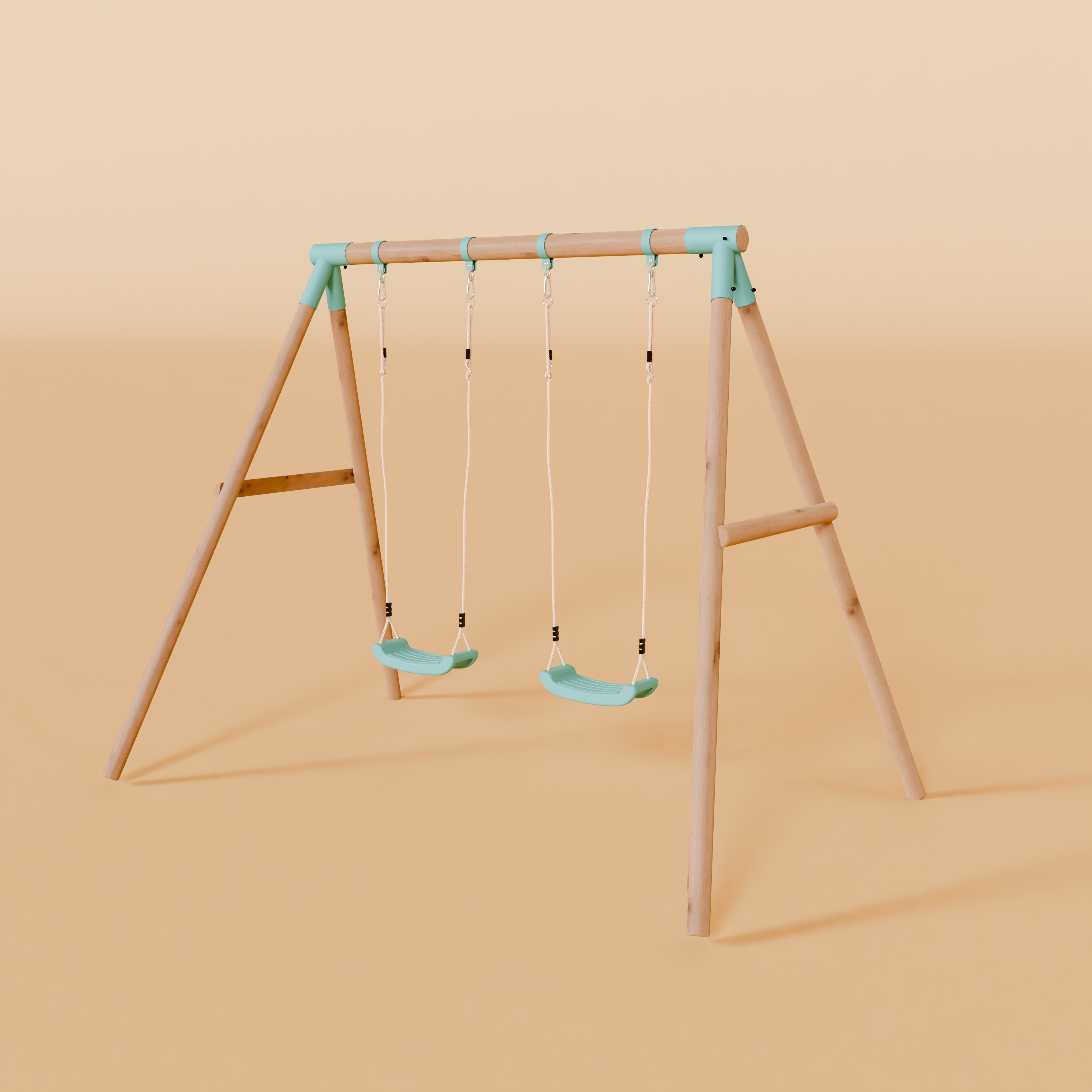 Children's swing set with two green seats on a beige background