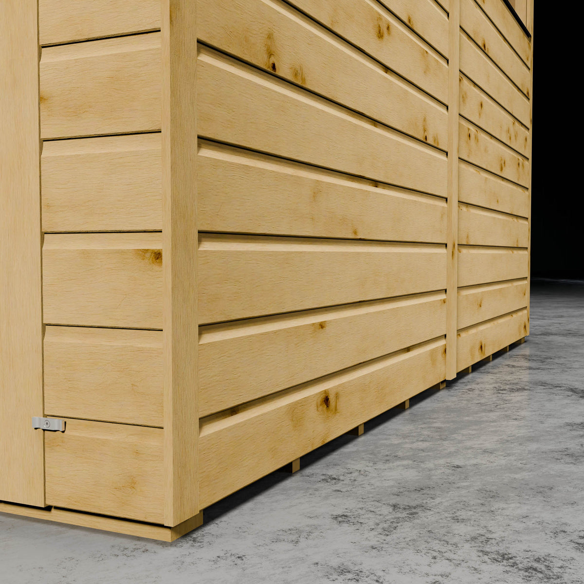 Wooden shiplap cladding of a shed on concrete floor.