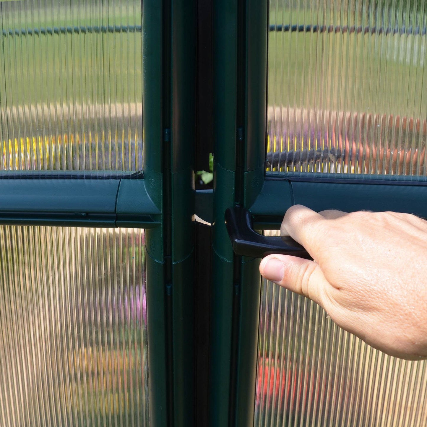 plastic door handle on a greenhouse