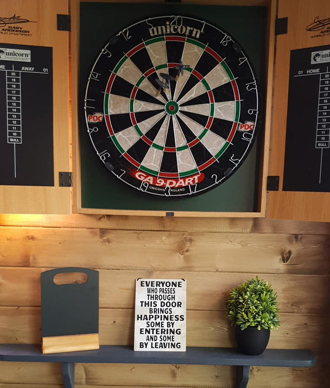 Darts board in The Black Pug log cabin Darts board in The Black Pug log cabin