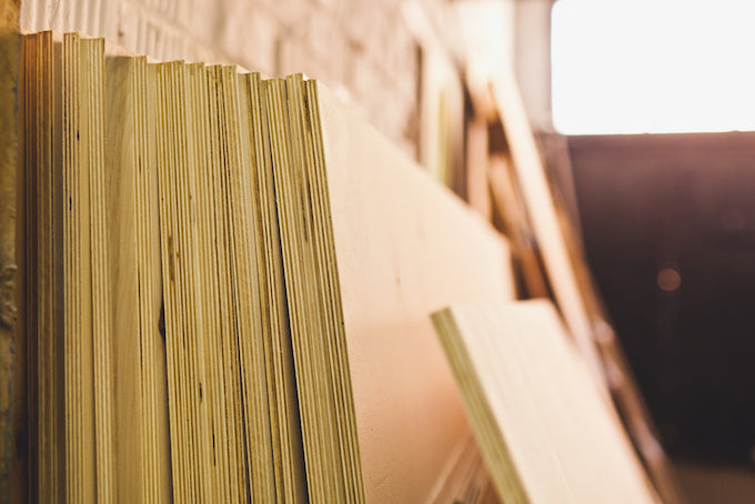 Plywood boards stacked together Plywood boards stacked together