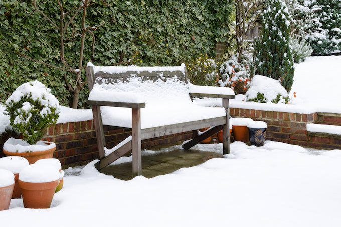 Wooden furniture covered in snow Wooden furniture covered in snow
