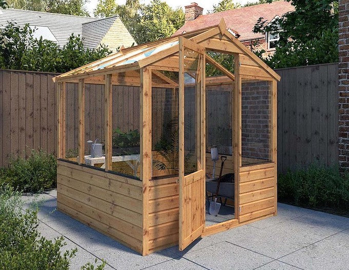 Narrow greenhouse in garden Narrow greenhouse in garden