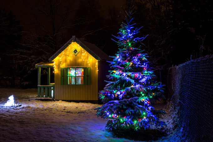 Decorated Christmas tree in garden Decorated Christmas tree in garden