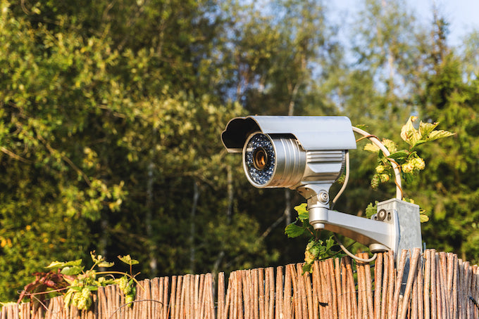 security camera on garden fence