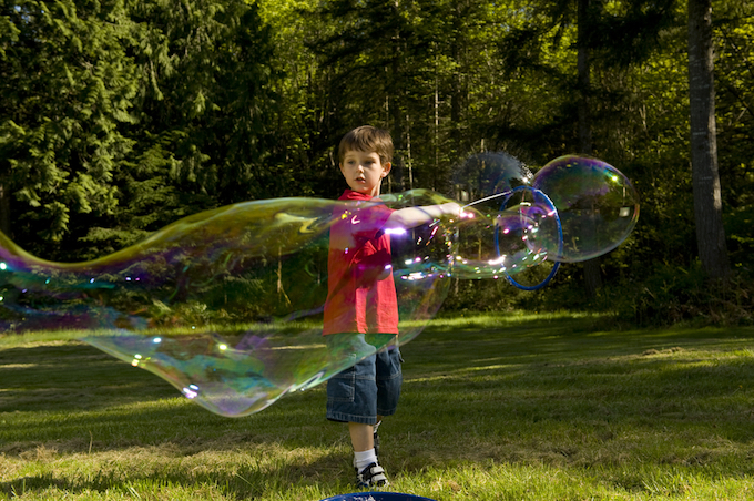 Little boy playing with bubbles Little boy playing with bubbles