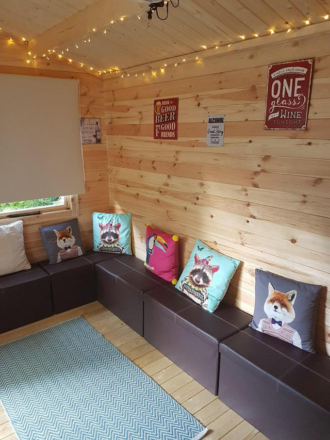 Corner of log cabin with seating Corner of log cabin with seating