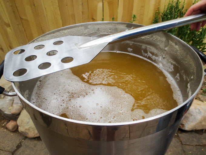 mashing process for beer in a metal bucket