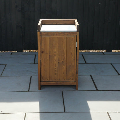 A cabinet from a timber outdoor kitchen
