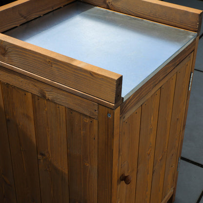 A cabinet from a timber outdoor kitchen