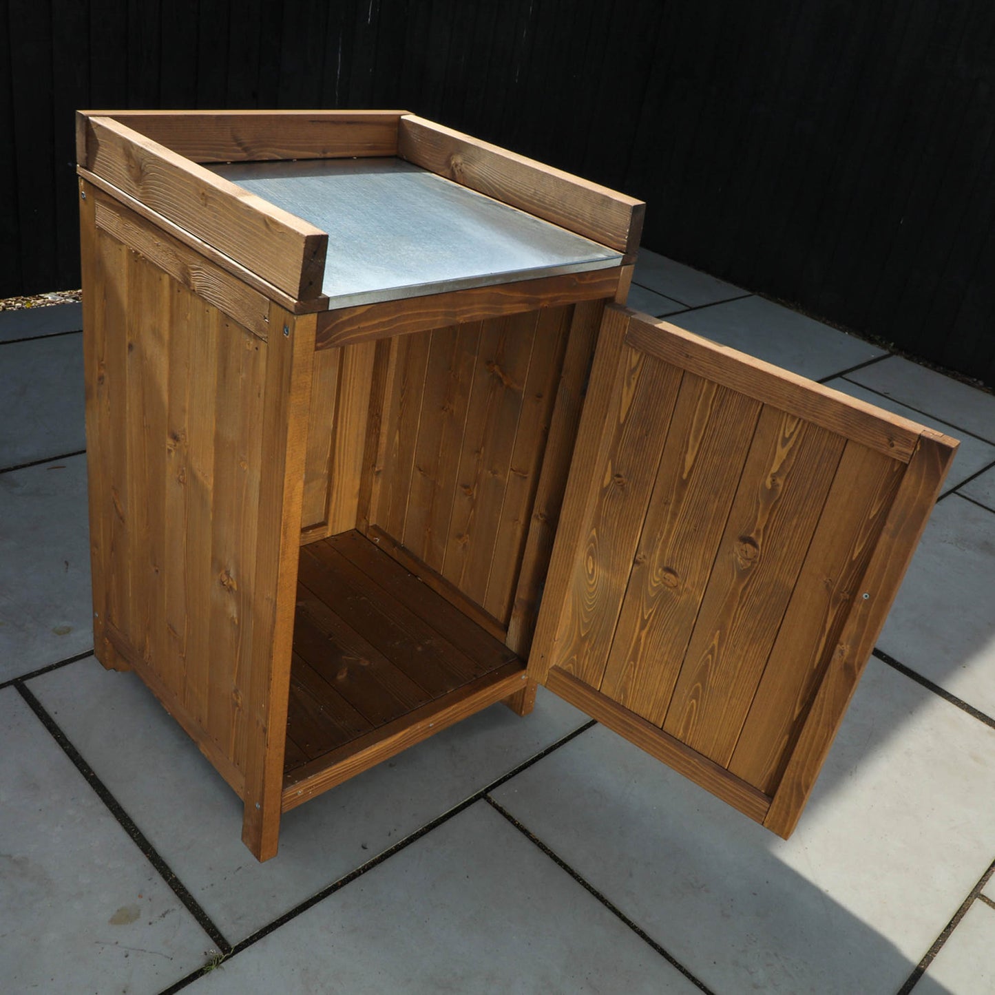 A cabinet from a timber outdoor kitchen