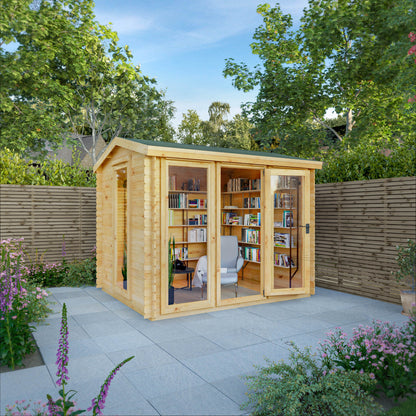 A modern log cabin with single door, full length windows, apex roof, decorated for reading and relaxation. 
