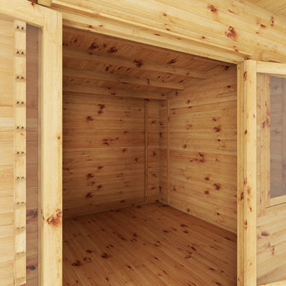 A curved roof log cabin with full length double doors and large windows