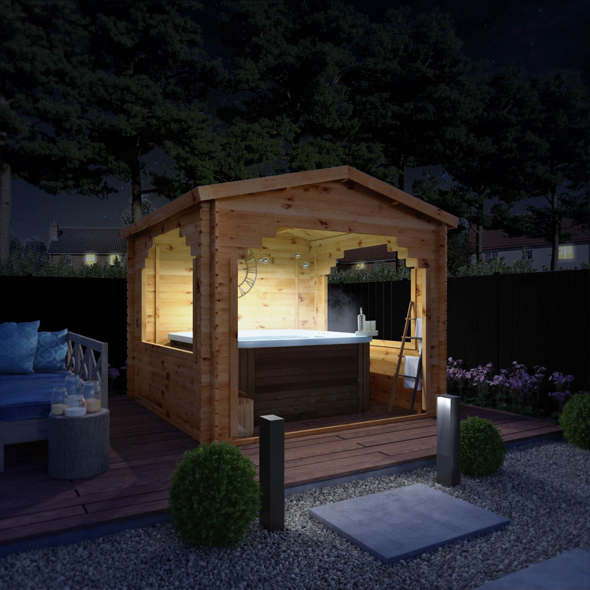 A log cabin gazebo with a hot tub inside, in a modern garden at night