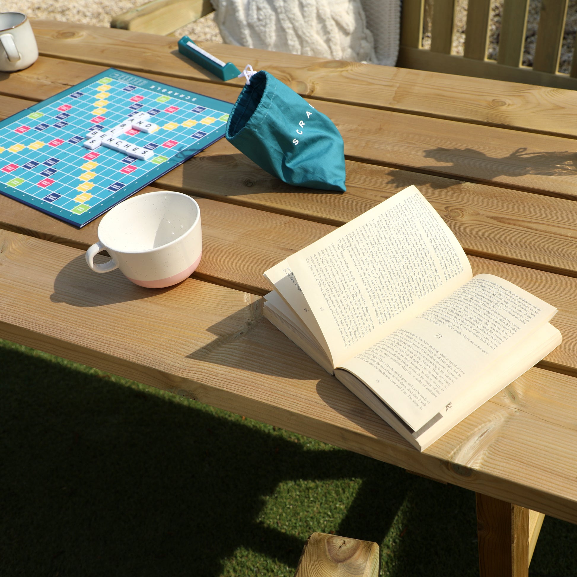 A picture of a timber bench and table set, featuring two benches and a wooden table