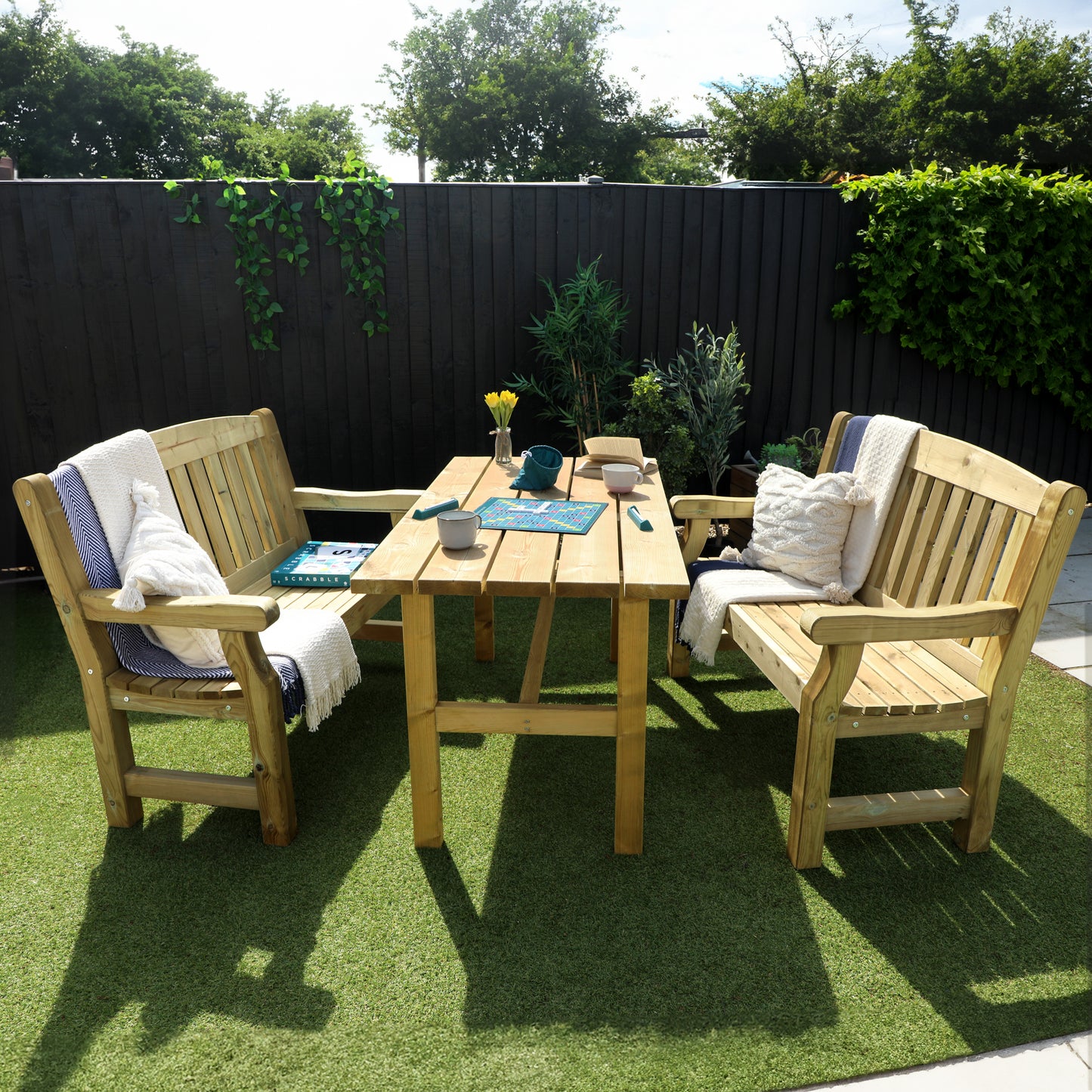 A picture of a timber bench and table set, featuring two benches and a wooden table