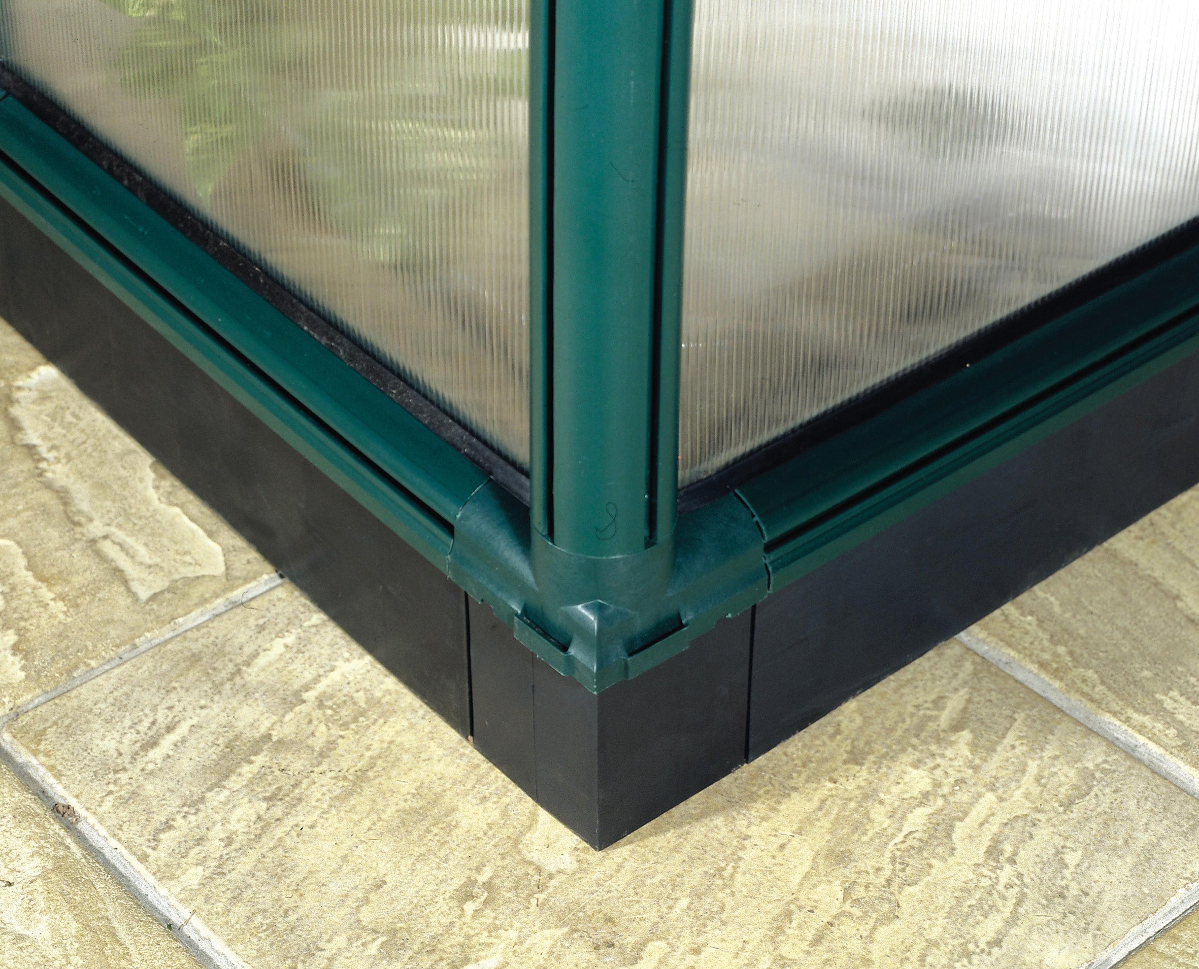 A plastic base for a plastic greenhouse