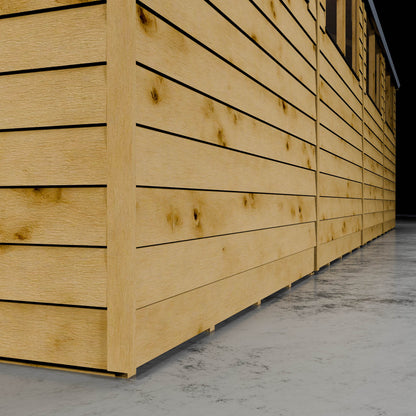 Wooden overlap shed cladding with styrene windows in a darkened setting.