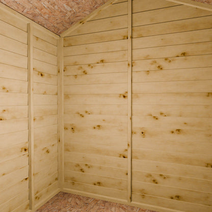 Wooden shed interior with slatted walls and an apex roof.