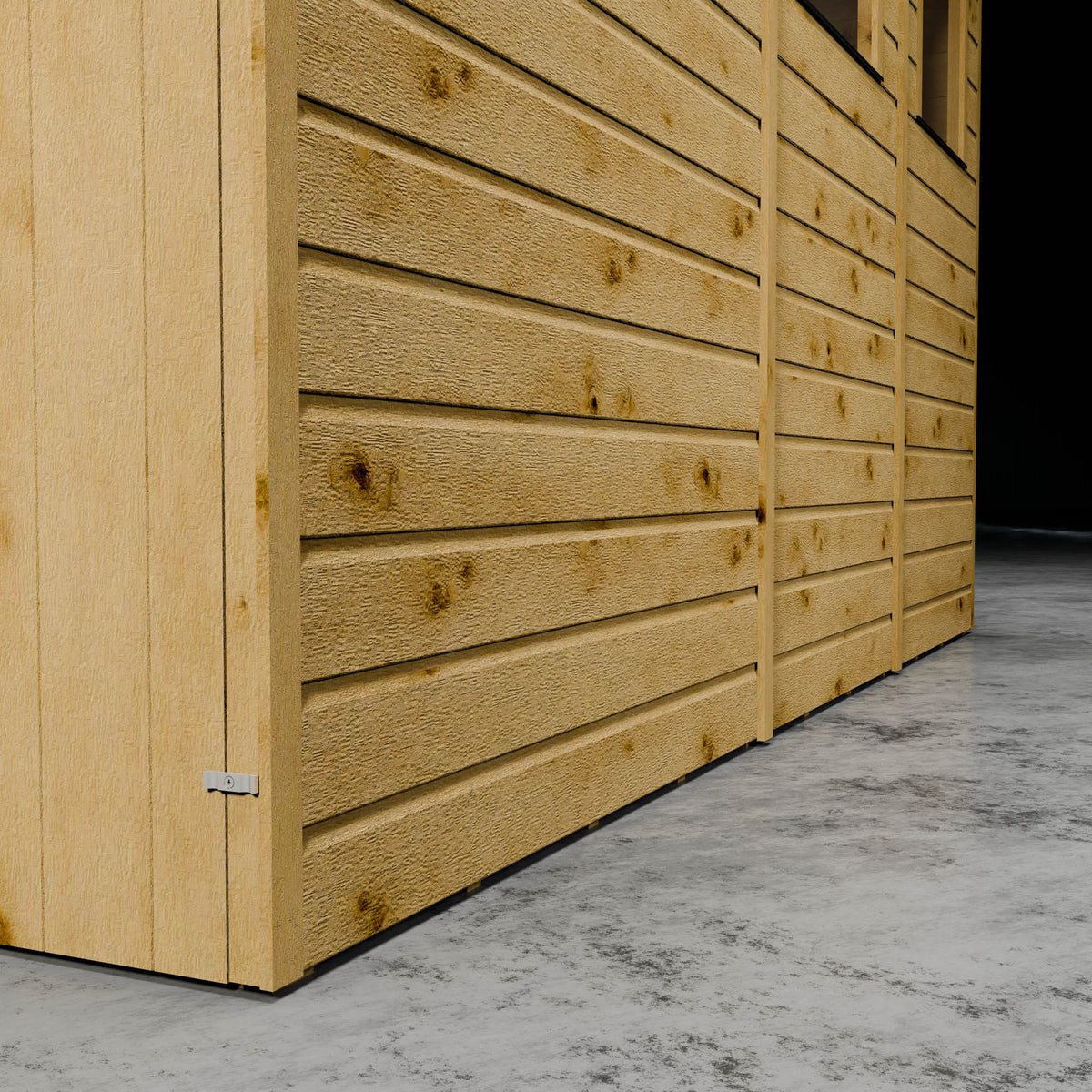 Wooden shiplap wall of a workshop with styrene windows in a darkened setting.