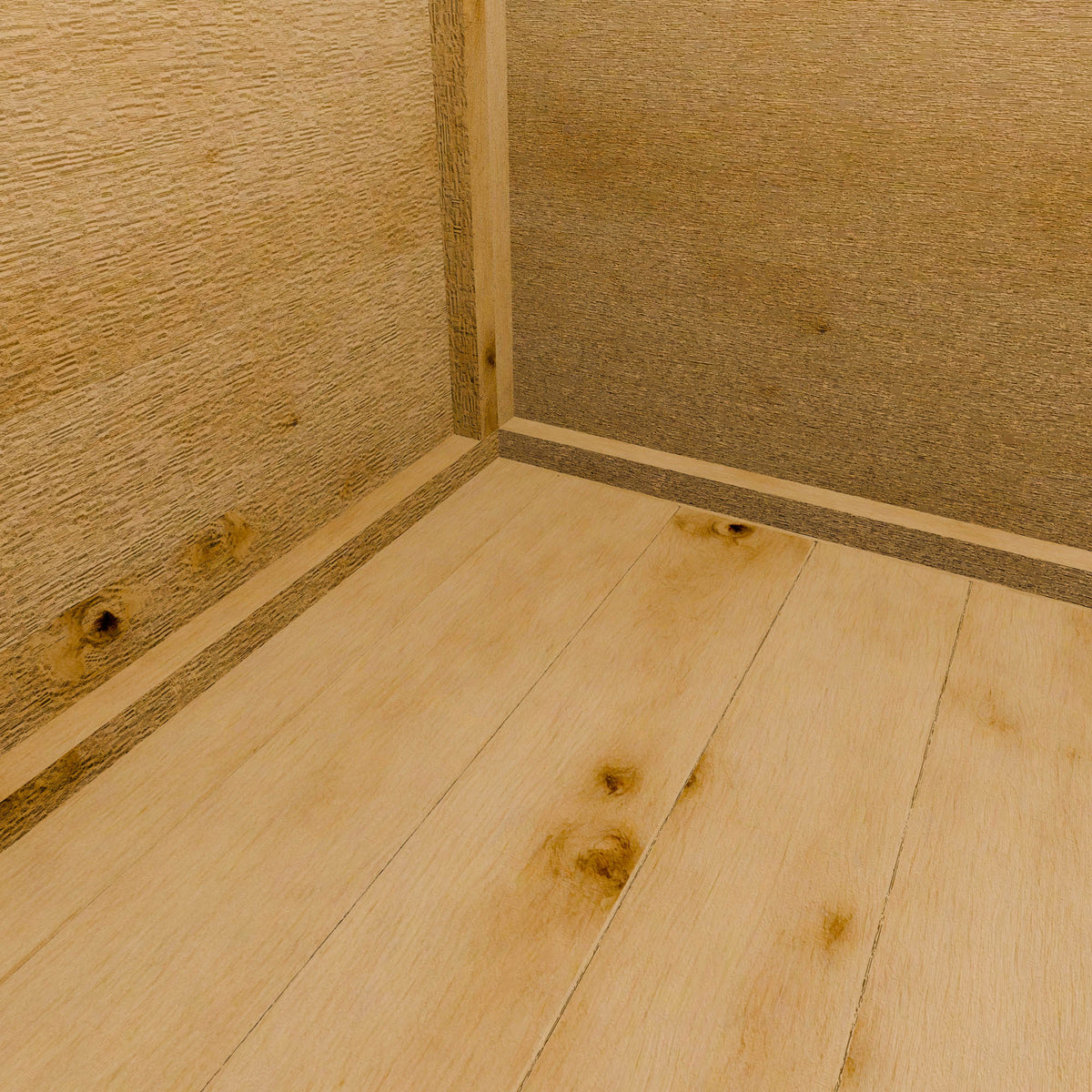 Close-up of wooden shed flooring with a visible corner.