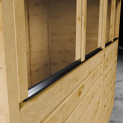 Close-up of a wooden shed with a window and metal flashing.
