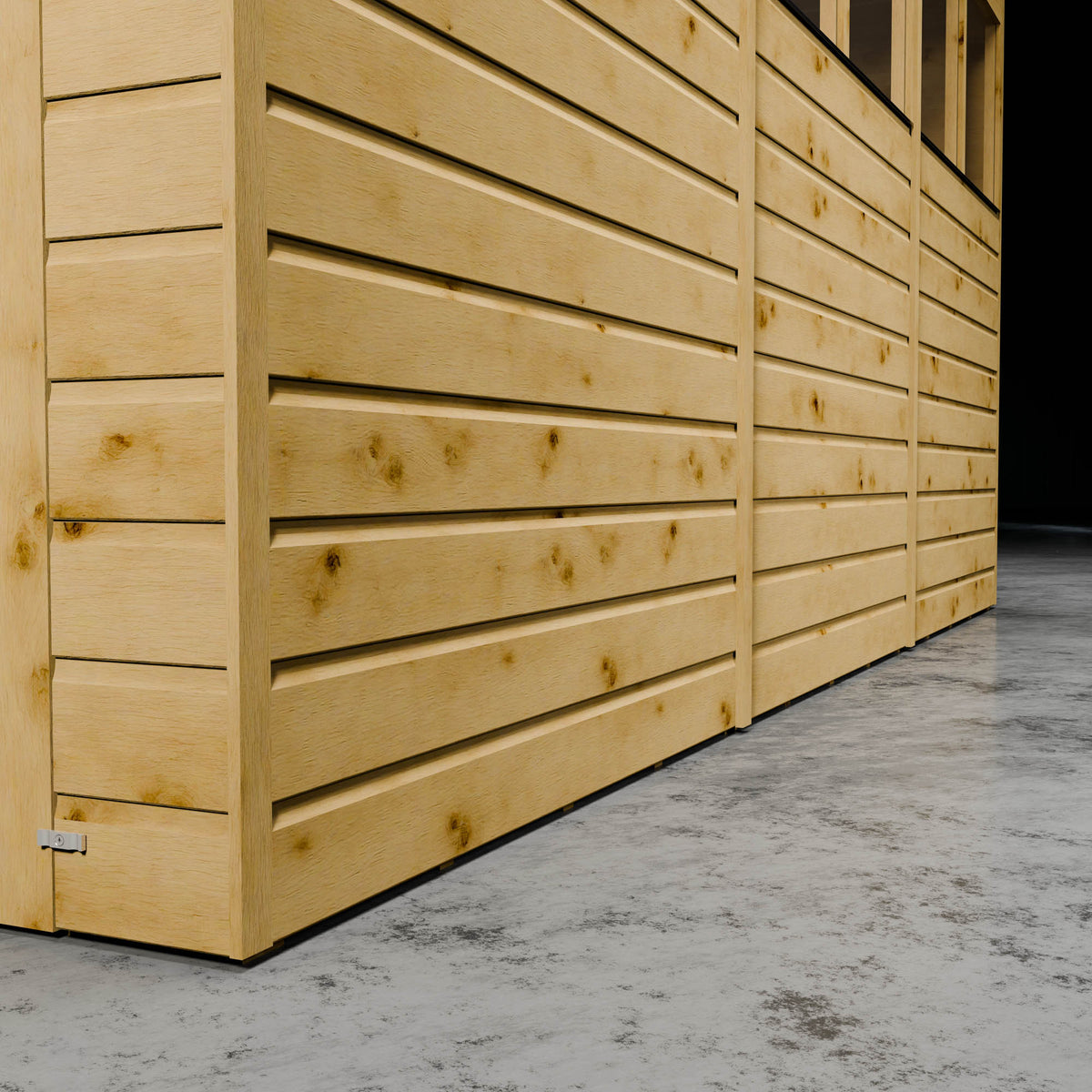 Wooden shiplap shed with styrene windows in a dark setting.