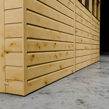 Wooden shiplap shed with styrene windows in a dark setting.