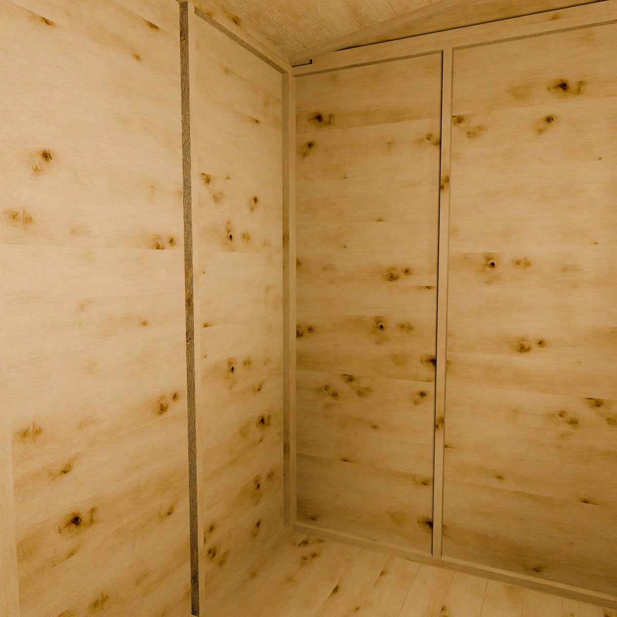 Wooden shed interior with panelled walls and ceiling.