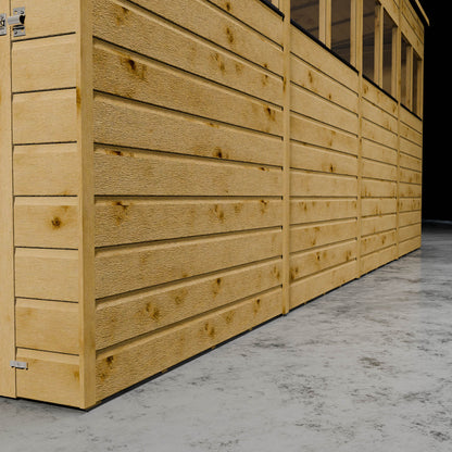 Wooden shiplap shed wall with styrene windows and door outline in a dark setting.
