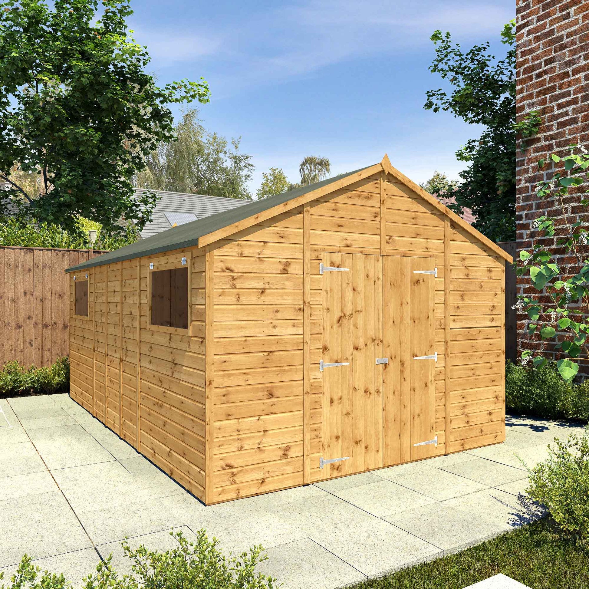 A large timber workshop with double doors, apex roof and windows