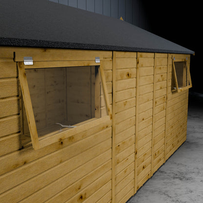 Open styrene windows of a wooden shiplap workshop in a metallic setting.