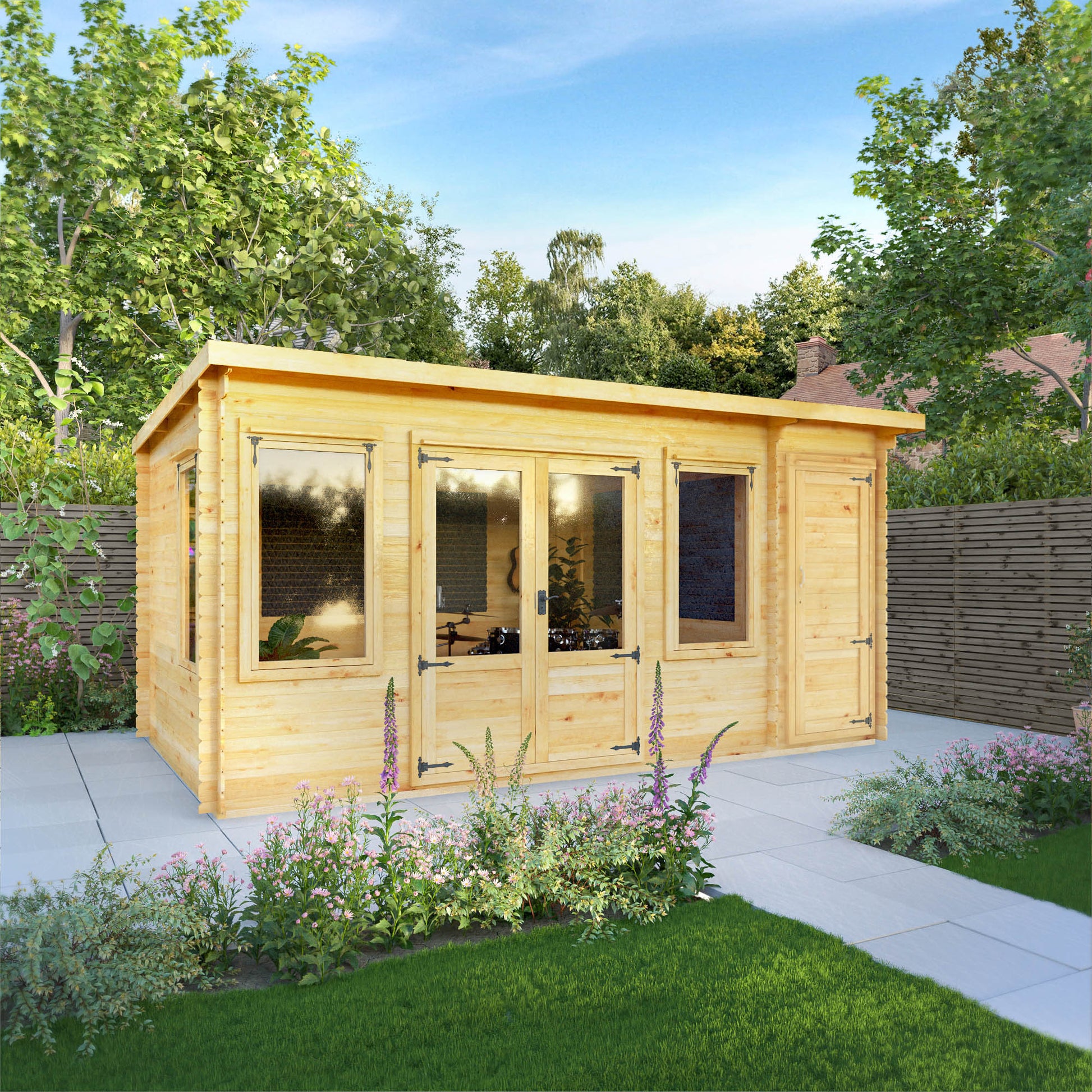 A timber log cabin with large windows, double doors, pent roof and side shed being used as a music room in a British garden