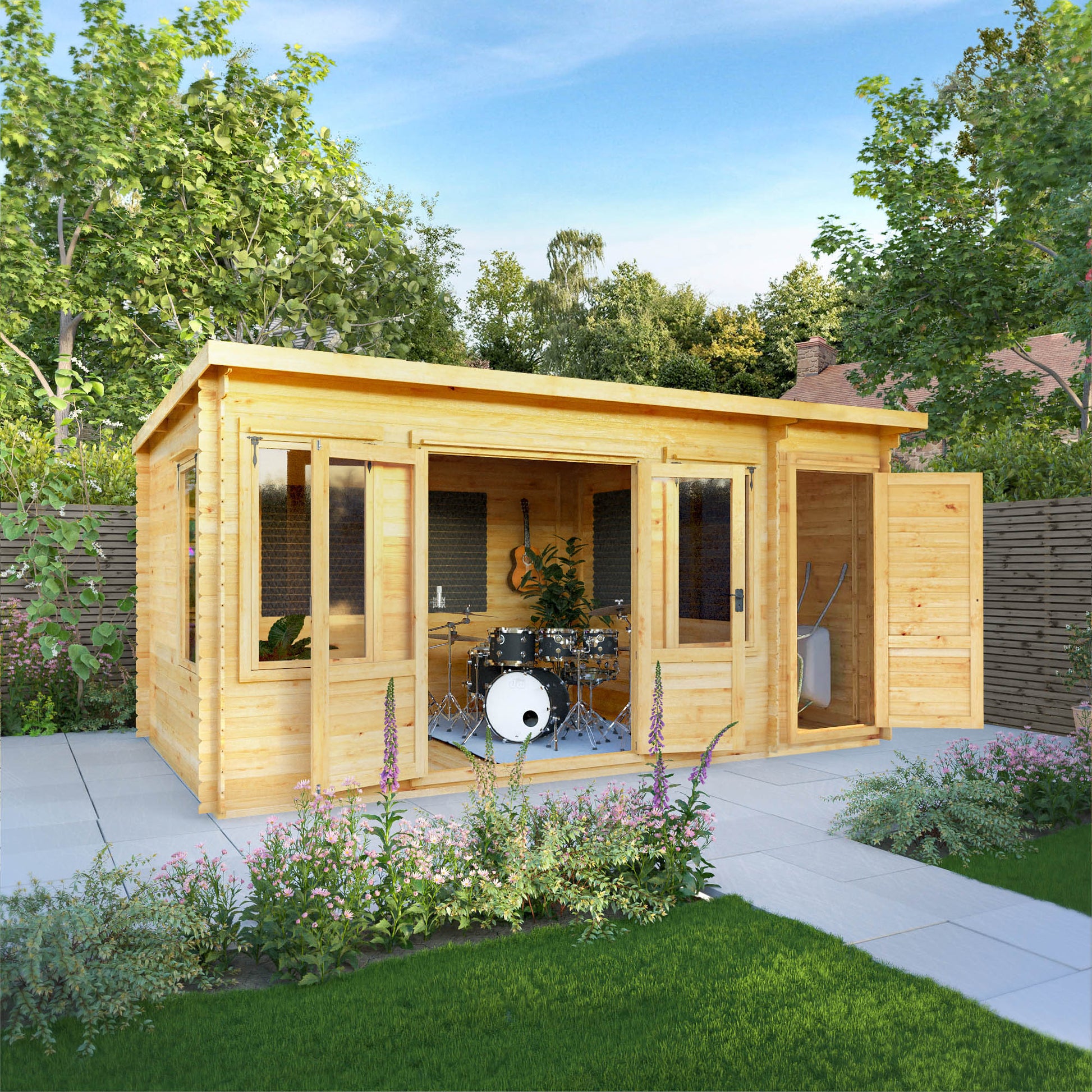 A timber log cabin with large windows, double doors, pent roof and side shed being used as a music room in a British garden