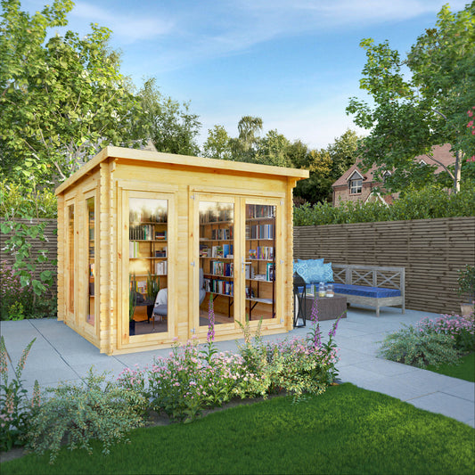 A modern timber log cabin with sloping flat roof, full length windows, double doors in a British garden being used as a reading room