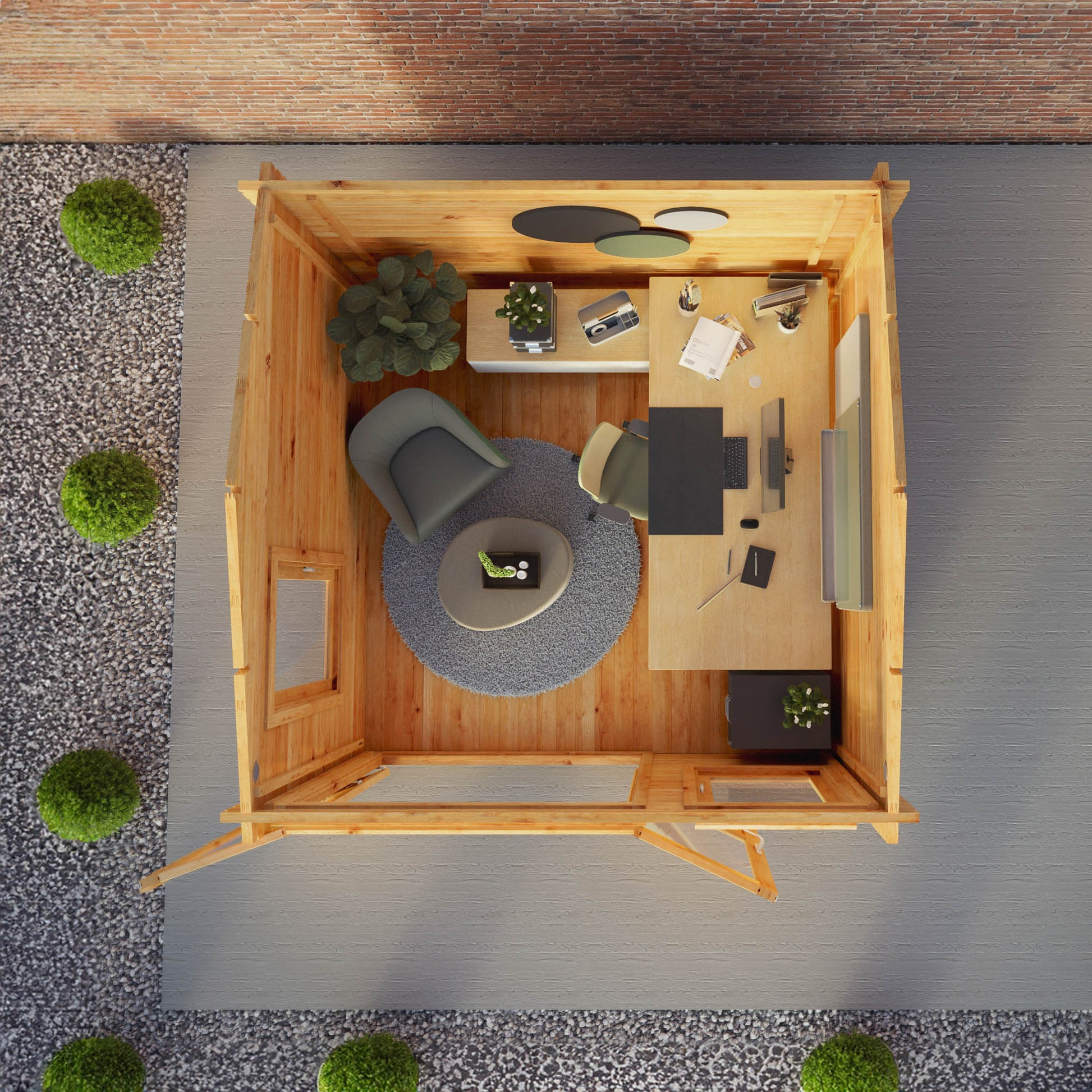 A small log cabin made from wood, with a pitched roof, double doors with opening windows being used as a home office