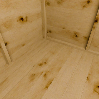 Close-up of a wooden shed floor with visible grain and knots