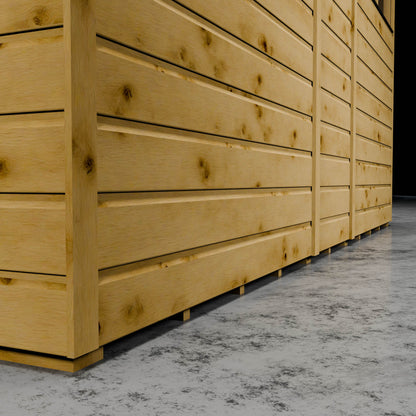 Wooden shiplap shed in a dark setting.