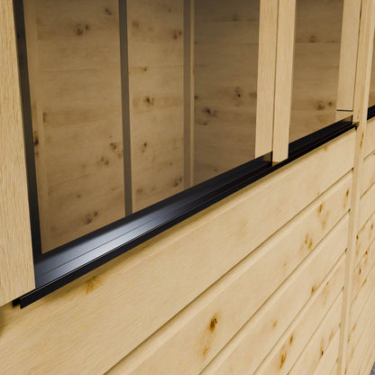 Wooden shiplap shed with styrene windows and black weatherproof cill.