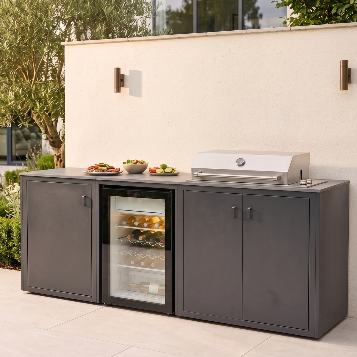 Vantage Linear Outdoor Kitchen with Fridge and 4 Burner BBQ, in use on a patio, Grey