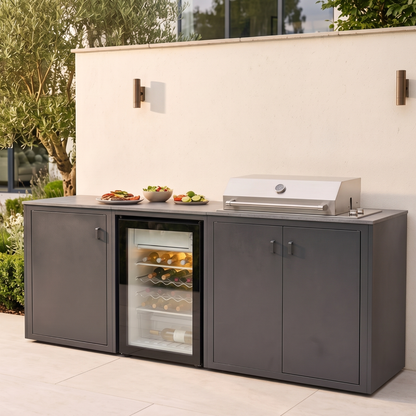 Vantage Linear Outdoor Kitchen with Fridge and 4 Burner BBQ, in use on a patio, Grey