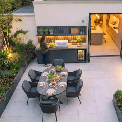 Waltons Strata Signature Outdoor Kitchen in Grey from above with a dining table laid for six