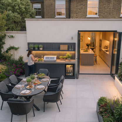 Waltons Strata Signature Outdoor Kitchen in Grey in use on a garden terrace at dusk