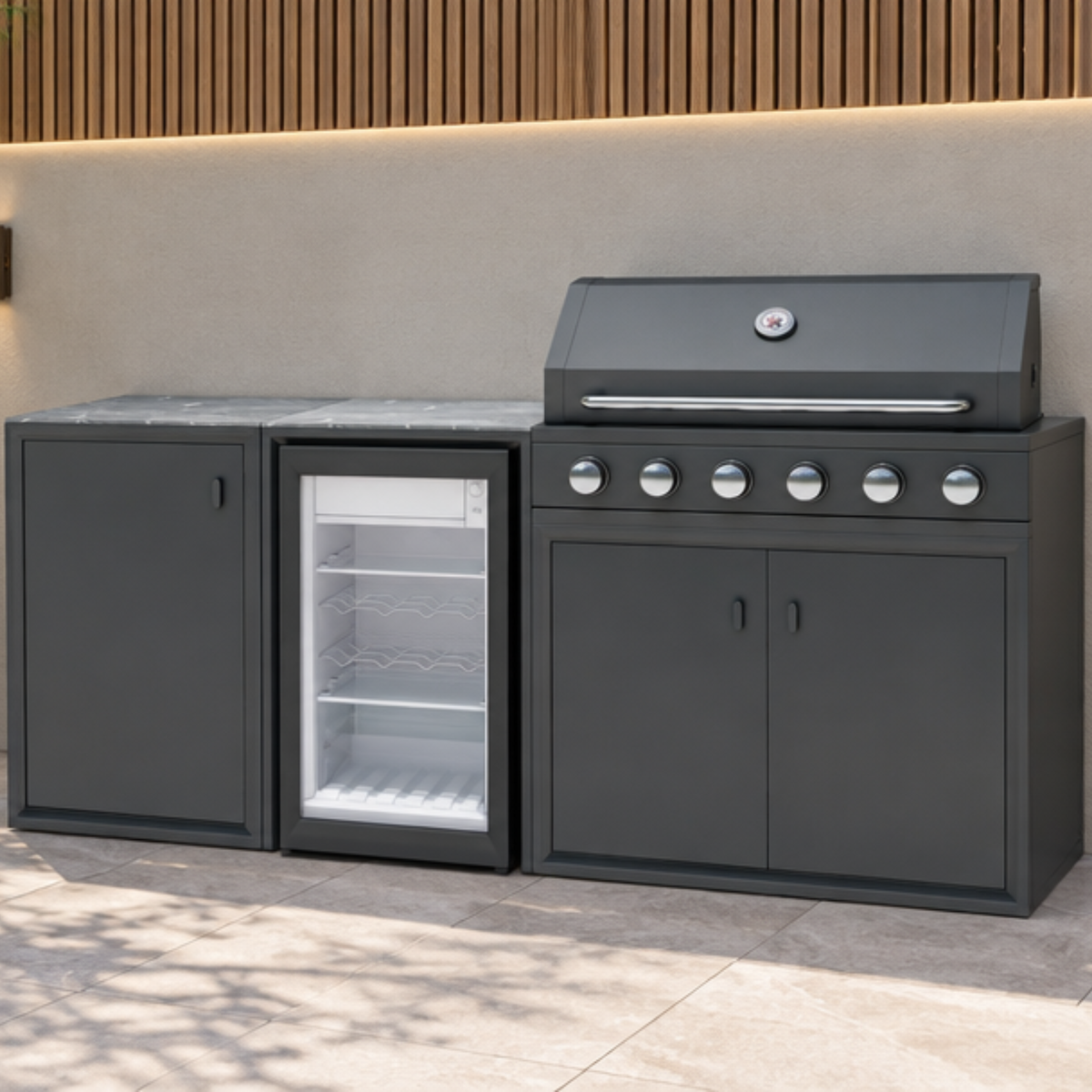 Vantage Compact Outdoor Kitchen with 6 Burner Gas BBQ and Fridge, on a patio by day, Grey