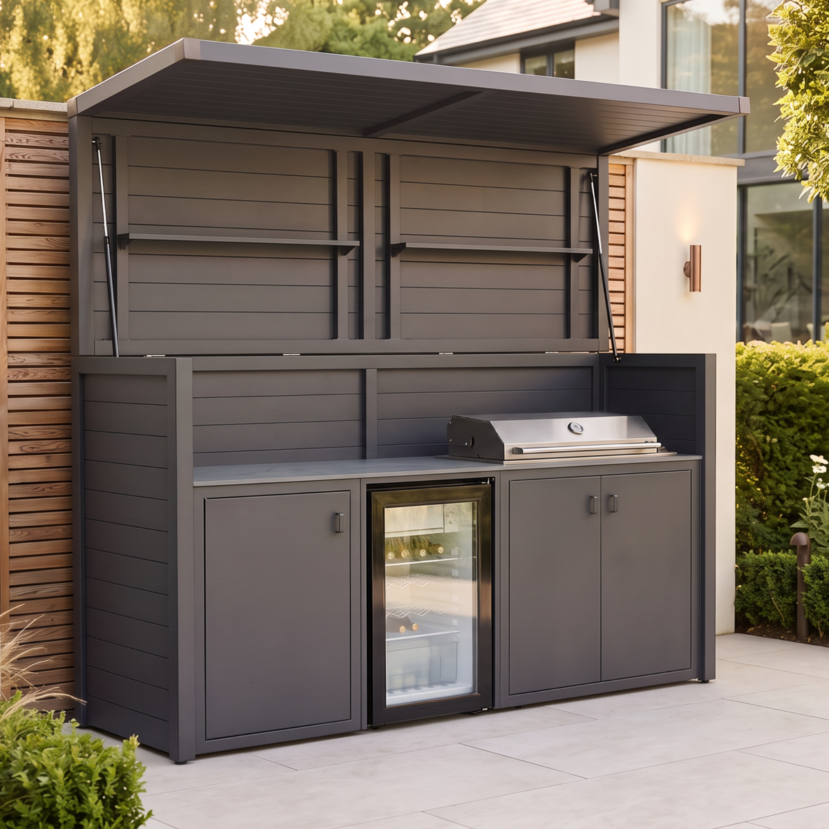 Vantage Outdoor Kitchen Pod with 4 Burner Gas Grill and Fridge, open on a patio by day, Grey#colour_grey