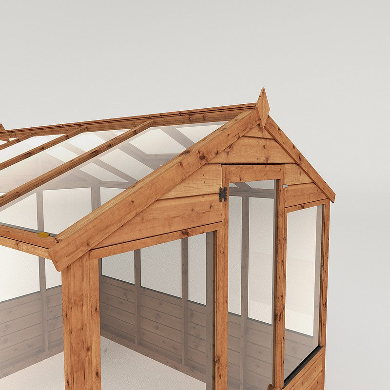 A timber greenhouse with a half glazed door and windows on all sides.