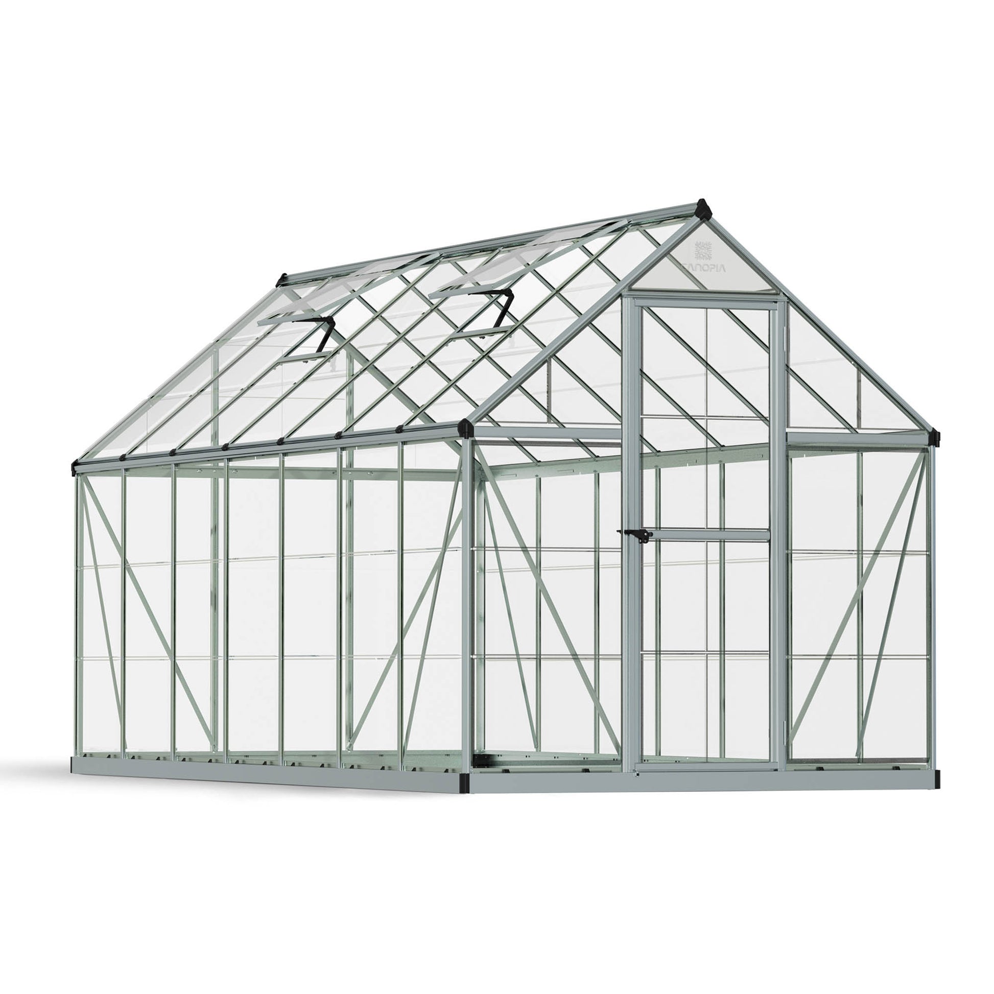 A greenhouse made up of windows with silver metal framing